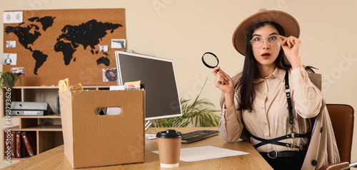 Shocked female spy with mag...