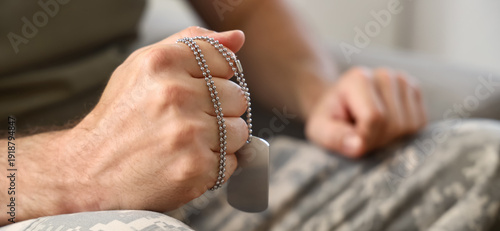 Male soldier with dog tag a...