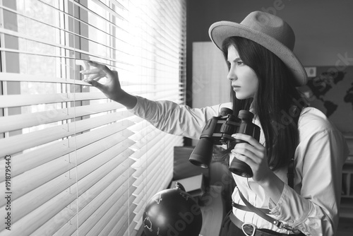 Female detective with binoc...