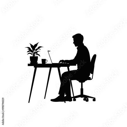 Man Working on Laptop at Desk Silhouette.