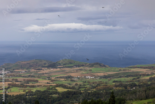 A cloudy sky with a large cloud in the background