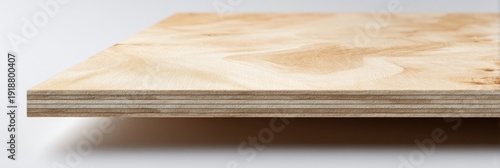 Close-up shot of a thin wooden panel with visible grain and layered structure