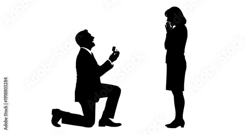 Man proposes to woman with ring in hand on one knee outdoors