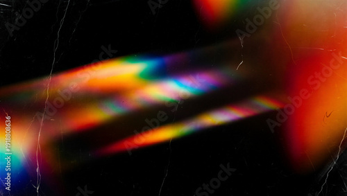 Abstract Rainbow Prism Light Leak and Flare Effect on Dark Scratched Background