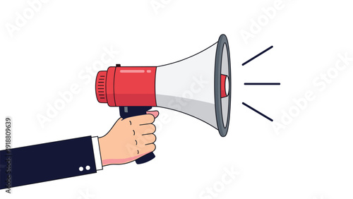 Close up of a person's hand in a suit holding a red and white megaphone or bullhorn for making announcements.