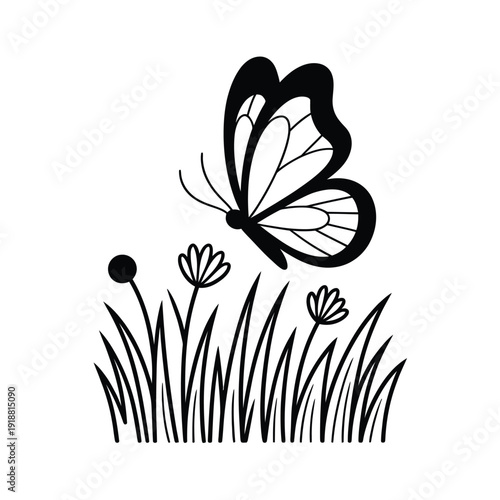 A delicate black butterfly hovers above wildflowers and blades of grass
