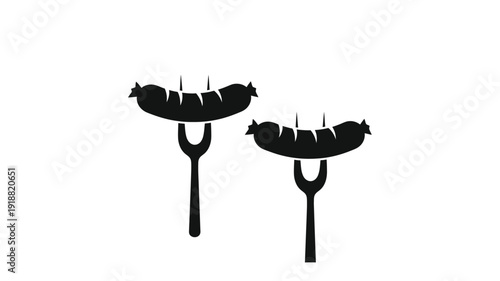 Two grilled sausages on forks a striking black silhouette