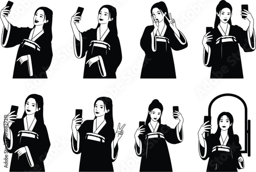 Young Asian woman in traditional clothing taking selfies with a smartphone and posing with peace signs.