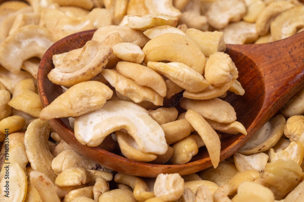 Fototapeta premium Cashew and wooden spoon,close-up