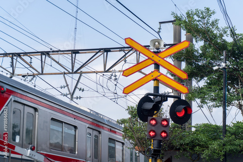 Canvastavla Railway Crossing Alert Red Lights and Approaching Train in Urban Setting