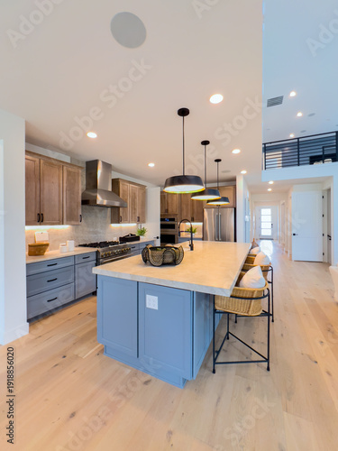 Spacious Kitchen with Island Wooden Countertop and Lights