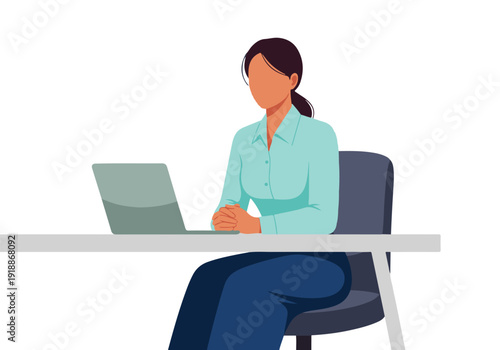 Professional businesswoman working on laptop at desk in a modern office