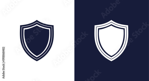 A strong and reliable graphic icon of a classic shield emblem with a double outline border, presented in a solid dark blue against a white background and crisp white against a dark blue background, sy