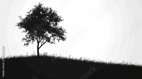 Silhouette of a solitary tree on a grassy hill against a gradient background