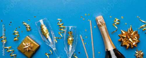 Wallpaper Mural Bottle of champagne with colored glitter, confetti and gift box space for text on colorfull background, top view. Hilarious, christmas and birthday celebration Torontodigital.ca