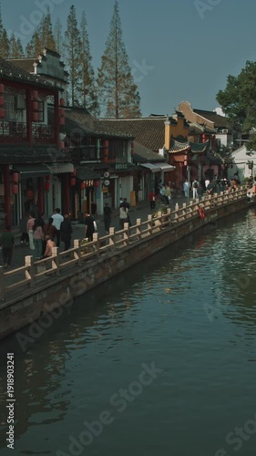 Captivating view of a bustling canal scene filled with tourists and locals. Zhujiajiao, Shanghai, China