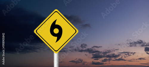 Hurricane Idalia warning sign against a powerful stormy background with copy space. Dirty and angled sign with cyclonic winds add to the drama.hurricane season sign on cloudy background