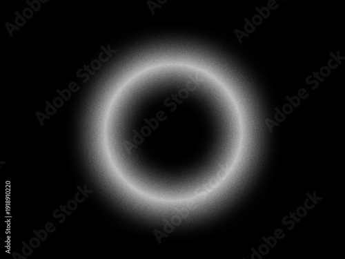 Abstract glowing white light ring on black background with grain texture