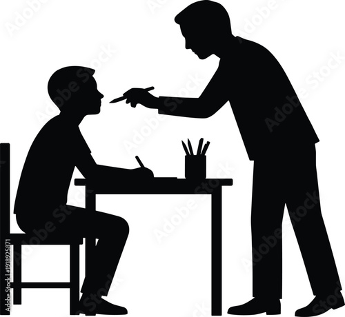 Black Silhouette Vector Illustration of a Teacher or Tutor Helping a Male Student Sitting at a Desk Writing with a Pen and Paper
