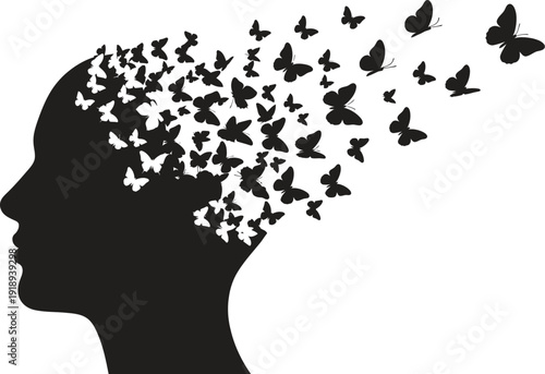 Silhouette of a human head with butterflies flying out symbolizing freedom and creativity