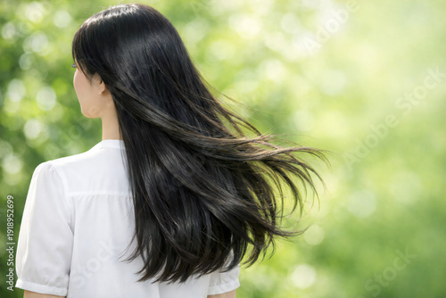 Beautiful Long Black Hair Flowing in the Wind Outdoors