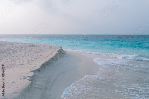 Vacation summer holidays leisure background - sunny tropical Caribbean paradise resort beach with white sand, lounger, palms on Maldive