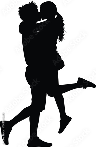 Silhouette of young romantic couple kissing and hugging while man lifts woman in air during sunset date representing love and passion