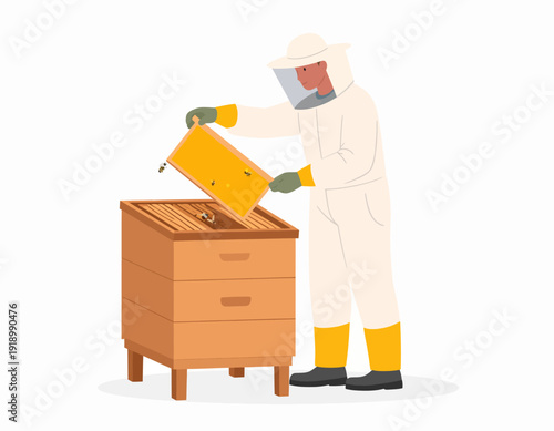 A beekeeper in a protective suit inspecting a wooden beehive and holding a honeycomb frame.