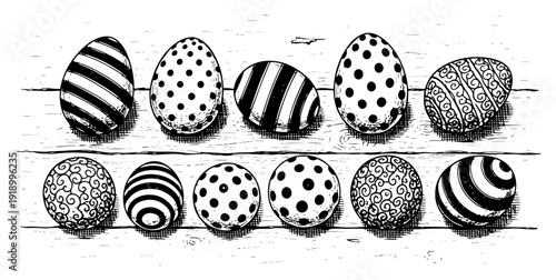 Black and white hand drawn illustration of various decorated easter eggs arranged on a wooden surface