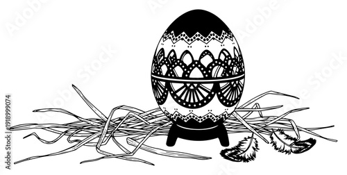Ornate decorated Easter egg with intricate patterns on a stand with straw and feathers silhouette