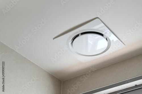 Cuadro en lienzo Modern ceiling ventilation fan, white square design, installed in bathroom ceili