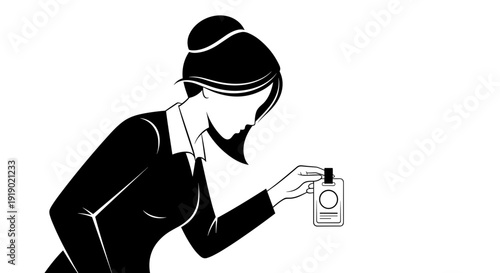 Woman examining perfume bottle while wearing elegant black dress  