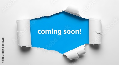 White paper ripped to reveal blue background with 