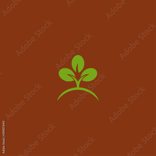 A simple logo featuring a green sprout against a brown background