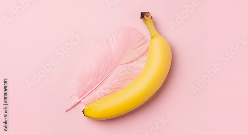 Wallpaper Mural Vibrant banana and delicate feather on soft pink background Torontodigital.ca