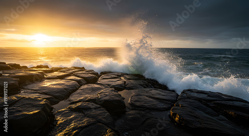 Dramatic ocean waves crashing against rugged coastal rocks during golden sunset against expansive sea horizon background