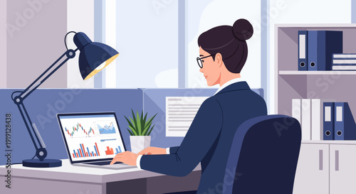 Woman Working on Laptop at Desk.