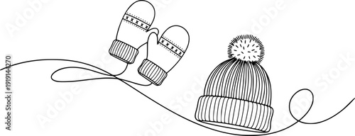 A winter knitted hat with a pom-pom and a pair of mittens on a wavy line, symbolizing warmth, winter holidays, and cozy warm clothing.