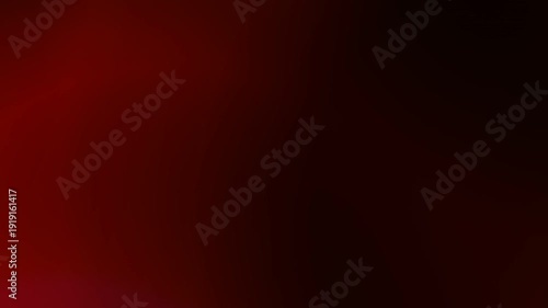 A dynamic abstract background featuring a gradient of deep red to dark hues with subtle light leaks, creating a moody and atmospheric effect suitable for various overlays or backdrops.