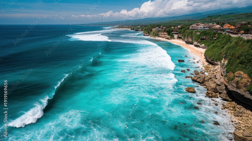 Aerial view of ocean waves crashing onto a sandy beach coastline scenery
