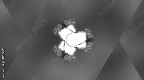 Abstract black and white geometric shapes with a bright center.