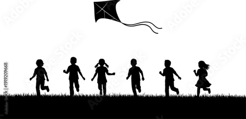 Group of happy children silhouettes running and playing with a kite in a field for summer outdoor activities and childhood freedom