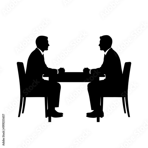 Two Men Sitting at Table Negotiating.