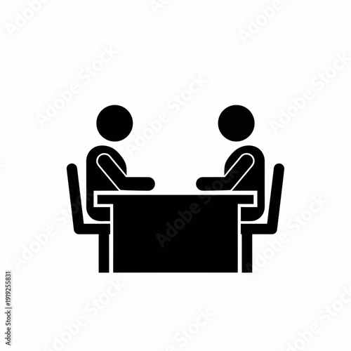 Two People Sitting at a Table.