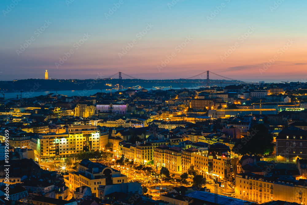 Naklejka premium Lisbon at night, the capital of Portugal by river Tagus