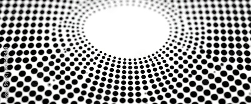 Black and white dots form pattern with a central empty space in the design