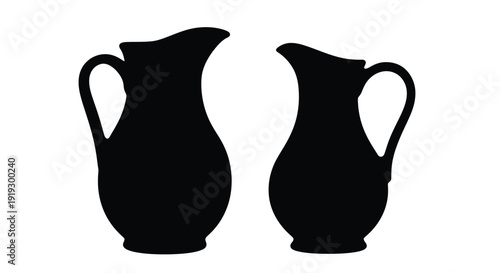 Two antique pitchers are displayed in a striking black silhouette