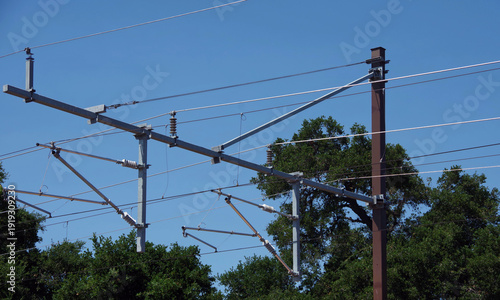 Electric railroad overhead wiring under blue sky