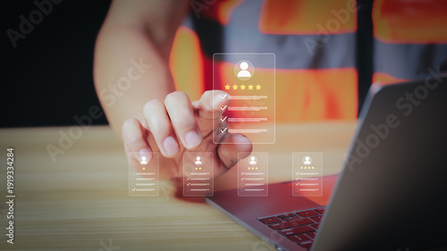 Canvas Print Industrial supervisor using futuristic technology to review employee performance and rating icons, human resource management and digital recruitment at office