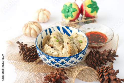Photos It's a bowl of Chinese dumplings, served with fiery chili oil as condiment